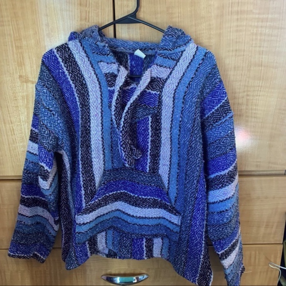 Multicolored poncho jacket made in Mexico.